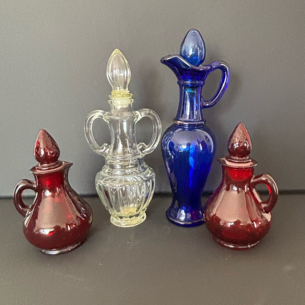 Set of Avon Vintage Decorative Glass Decanters in Red, Clear, and Blue